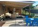 Spacious covered patio with furniture set, play area, and natural outdoor views at 290 Pierce St, Lakewood, CO 80226