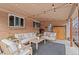 Covered patio with stylish seating, brick wall, and decorative string lights overhead at 290 Pierce St, Lakewood, CO 80226