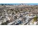 Aerial view of house and neighborhood, snow-covered landscape at 2527 S Coors St, Lakewood, CO 80228