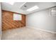 Finished basement room with wood-paneled accent wall at 2527 S Coors St, Lakewood, CO 80228