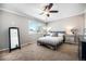 Cozy bedroom with ceiling fan and ample closet space at 2527 S Coors St, Lakewood, CO 80228