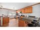 Modern kitchen featuring wood cabinets and granite countertops at 2527 S Coors St, Lakewood, CO 80228