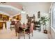 Inviting dining area with a stylish chandelier, elegant furnishings, and natural light at 4143 Da Vinci Dr, Longmont, CO 80503