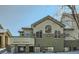 Two-story townhouse showcasing unique architectural design and complemented by a snow-covered landscape, offering a modern and cozy appeal at 4143 Da Vinci Dr, Longmont, CO 80503