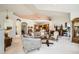 Spacious living room with seamless flow into the dining area and kitchen, showcasing a harmonious and inviting living space at 4143 Da Vinci Dr, Longmont, CO 80503