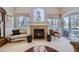 Inviting living room showcases a fireplace, comfortable seating, large windows, and a decorative Angel window at 4143 Da Vinci Dr, Longmont, CO 80503