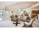 Open-concept living room showcasing comfortable seating, natural light, and seamless flow into dining and kitchen areas at 4143 Da Vinci Dr, Longmont, CO 80503
