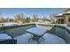Charming patio area featuring snow-covered table, ideal for outdoor dining and relaxation at 4143 Da Vinci Dr, Longmont, CO 80503