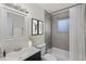 Updated bathroom with a vanity, bathtub, and a gray tiled shower at 12516 E Alaska Ave, Aurora, CO 80012