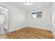 Light and airy bedroom with hardwood floors and access to kitchen at 12516 E Alaska Ave, Aurora, CO 80012