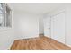 Spacious bedroom with hardwood floors and double doors at 12516 E Alaska Ave, Aurora, CO 80012
