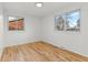 Bright bedroom with hardwood floors and large windows at 12516 E Alaska Ave, Aurora, CO 80012