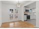 Bright dining area with hardwood floors and view into the kitchen at 12516 E Alaska Ave, Aurora, CO 80012