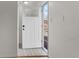 Bright entryway with new white door and tiled flooring at 12516 E Alaska Ave, Aurora, CO 80012