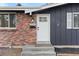 Renovated front entrance with new door, steps, and landscaping at 12516 E Alaska Ave, Aurora, CO 80012