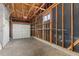 Unfinished garage with built-in shelving and storage at 12516 E Alaska Ave, Aurora, CO 80012