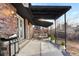 Relaxing patio with a covered pergola, seating area, and grill at 12516 E Alaska Ave, Aurora, CO 80012