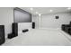 Home theater in basement features large screen, speakers, and comfy seating at 423 N Snowmass Cir, Superior, CO 80027