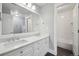 Modern bathroom with dual sinks, quartz countertops, and a tiled shower/tub combination for a clean, stylish look at 423 N Snowmass Cir, Superior, CO 80027