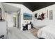 Bedroom view featuring a decorative wall design with a television and ensuite bathroom that offers both comfort and style at 423 N Snowmass Cir, Superior, CO 80027