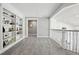 Upstairs hallway features custom built-in bookshelves on one side and a view of the staircase on the other at 423 N Snowmass Cir, Superior, CO 80027