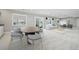 Open concept living room with a dining area, large windows, and modern furniture at 423 N Snowmass Cir, Superior, CO 80027