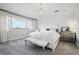 Elegant main bedroom featuring plush carpets, a chandelier, and a cozy window nook for a restful retreat at 423 N Snowmass Cir, Superior, CO 80027