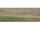Tranquil view of rolling hills and native grasses at 423 N Snowmass Cir, Superior, CO 80027