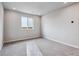 Bright bedroom with large window, soft carpet, and neutral walls at 14441 Clover Dr, Mead, CO 80504