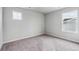 Bright bedroom with large windows and soft carpet, creating a serene and inviting atmosphere at 14441 Clover Dr, Mead, CO 80504