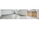 Spacious living room with gray floors and sliding door to backyard, offering modern comfort at 14441 Clover Dr, Mead, CO 80504