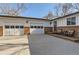 Charming ranch-style house with a two-car garage and a front porch at 1740 Shavano St, Longmont, CO 80504