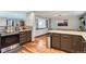 Open kitchen layout with stainless steel appliances and a view into the dining area at 1740 Shavano St, Longmont, CO 80504