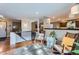 Cozy living room space with rocking chairs, hardwood floors, and stylish decor accents at 1740 Shavano St, Longmont, CO 80504