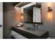 Modern bathroom featuring a unique floating sink and vanity, accented by stylish sconces at 2955 Inca St # 2F, Denver, CO 80202
