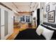 Open loft bedroom with modern features and hardwood floors at 2955 Inca St # 2F, Denver, CO 80202
