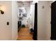 Hallway leading to bedroom space with ample storage and decorative artwork at 2955 Inca St # 2F, Denver, CO 80202