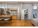 Modern kitchen with stainless steel appliances, wood cabinets, and an island with seating at 2955 Inca St # 2F, Denver, CO 80202