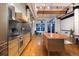 A bright, modern kitchen featuring a large island and stainless steel appliances at 2955 Inca St # 2F, Denver, CO 80202