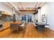 Spacious open-concept living area with kitchen island and modern design features at 2955 Inca St # 2F, Denver, CO 80202