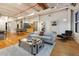 Inviting living room with hardwood floors, large windows, and stylish decor at 2955 Inca St # 2F, Denver, CO 80202