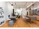 Expansive living space with an open layout, featuring modern art, dining, and a bedroom alcove at 2955 Inca St # 2F, Denver, CO 80202