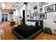Stylish bedroom featuring a platform bed with black bedding and decorative artwork on the wall at 2955 Inca St # 2F, Denver, CO 80202