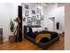 Serene bedroom showcasing unique wall art and ambient lighting for relaxation at 2955 Inca St # 2F, Denver, CO 80202