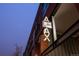 An illuminated sign for the building, reading 'AJAX Lofts' in a stylized font at 2955 Inca St # 2F, Denver, CO 80202