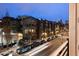 An exterior shot of a multi-story building on a busy street at dusk at 2955 Inca St # 2F, Denver, CO 80202