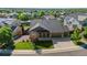 Inviting single-story home featuring a well-kept lawn and a two-car garage, nestled in a serene neighborhood at 3853 S Malta St, Aurora, CO 80013