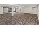 Large basement with updated carpeting and a support beam at 3853 S Malta St, Aurora, CO 80013