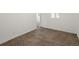 Bedroom with neutral walls, patterned carpeting, and natural light at 3853 S Malta St, Aurora, CO 80013