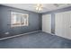 Neutral bedroom with two closets, window, and carpeted floor offer a comfortable space at 3853 S Malta St, Aurora, CO 80013